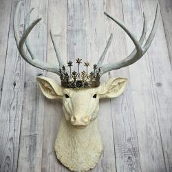 faux taxidermy deer head, painted antique white with icy blue grey antlers. A removable Santos star crown sits atop the deers head.