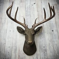 Faux taxidermy deer head painted chestnut brown with dark copper accents and dark copper antlers.