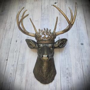 Faux taxidermy deer head wall mount. Painted rubbed bronze with antique gold accents. The antlers are antique gold and an antique gold metal leaf crown rests atop the deer head.