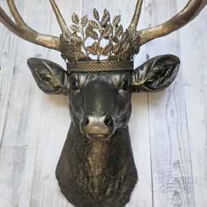 Faux taxidermy deer head wall mount. Painted rubbed bronze with antique gold accents. The antlers are antique gold and an antique gold metal leaf crown rests atop the deer head.