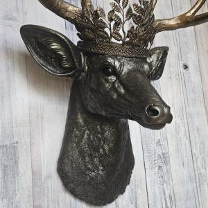 Faux taxidermy deer head wall mount. Painted rubbed bronze with antique gold accents. The antlers are antique gold and an antique gold metal leaf crown rests atop the deer head.