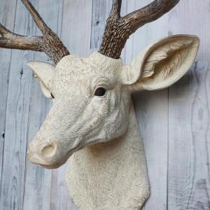 Faux taxidermy deer head wall mount. Head is painted antique white with antique gold accents, antlers are antique gold with antique white accents.
