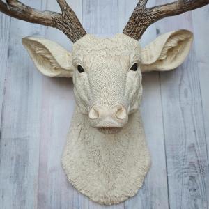 Faux taxidermy deer head wall mount. Head is painted antique white with antique gold accents, antlers are antique gold with antique white accents.