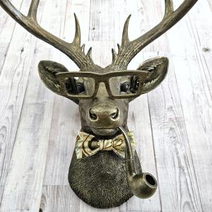 faux taxidermy deer head with glassses, bow tie and pipe, frankie stag