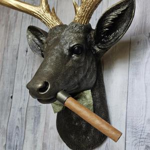 faux taxidermy deer head with cigar and bow tie.