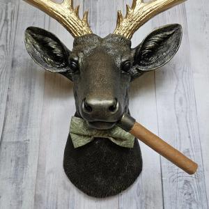 faux taxidermy deer head with cigar and bow tie.