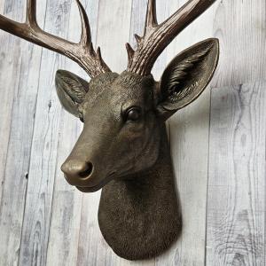 Faux taxidermy deer head painted chestnut brown with dark copper accents and dark copper antlers.