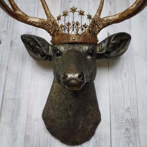 Faux taxidermy stag head, faux taxidermy deer head that's been painted rubbed bronze with antique gold accents. The antlers have been painted antique gold and a vintage inspired Santos crown adorns the deers head.