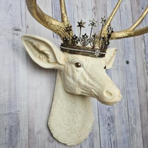 Faux taxidermy deer head wall mount, painted antique white with gold accents and gold antlers. A vintage rhinestone encrusted Santos star crown rests atop the deers head.