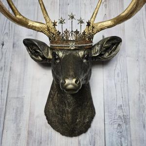 Faux taxidermy deer head wall mount, painted rubbed bronze with gold accents and gold antlers. A vintage rhinestone encrusted Santos star crown rests atop the deers head.