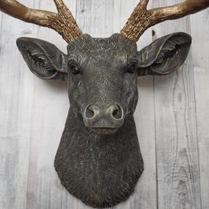 Faux taxidermy deer head painted chestnut brown and accented with antique white and antique gold, in order to bring out the beautiful details in the cast. The antlers have been painted antique gold and the eyes have been painted black.