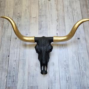 faux taxidermy steer skull, painted black with gold horns