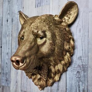 faux taxidermy bear head wall mount, painted gold with rose gold accents. a leopard bow tie accents the neck of the bear