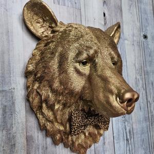faux taxidermy bear head wall mount, painted gold with rose gold accents. a leopard bow tie accents the neck of the bear