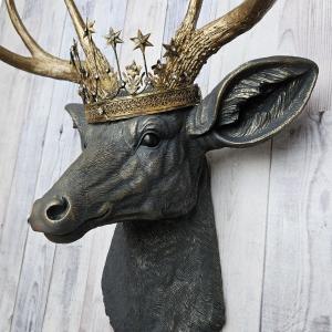 Faux taxidermy deer head, painted slate grey with antique gold accents. The antlers are antique gold and a vintage inspired Santos star crown rests atop the deers head