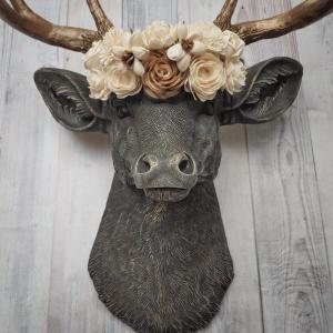 Faux taxidermy deer head, painted chestnut brown with antique white and gold accenting. The antlers are antique gold and a cream floral crown sits atop the deer head.
