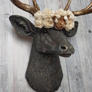 Faux taxidermy deer head, painted chestnut brown with antique white and gold accenting. The antlers are antique gold and a cream floral crown sits atop the deer head.