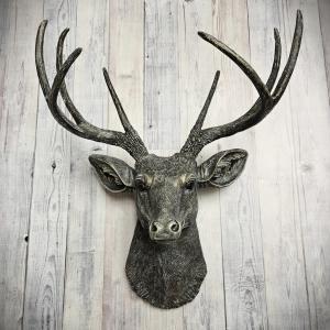 Faux taxidermy deer head, painted chestnut brown with antique white and gold accents. The antlers have been painted the same way.