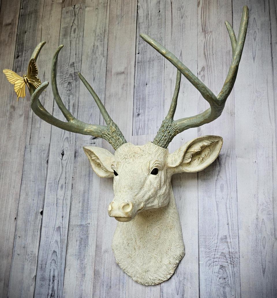 faux taxidermy deer head wall mount, painted antique white with gold and italian sage accents, the antlers are italian sage with gold accents