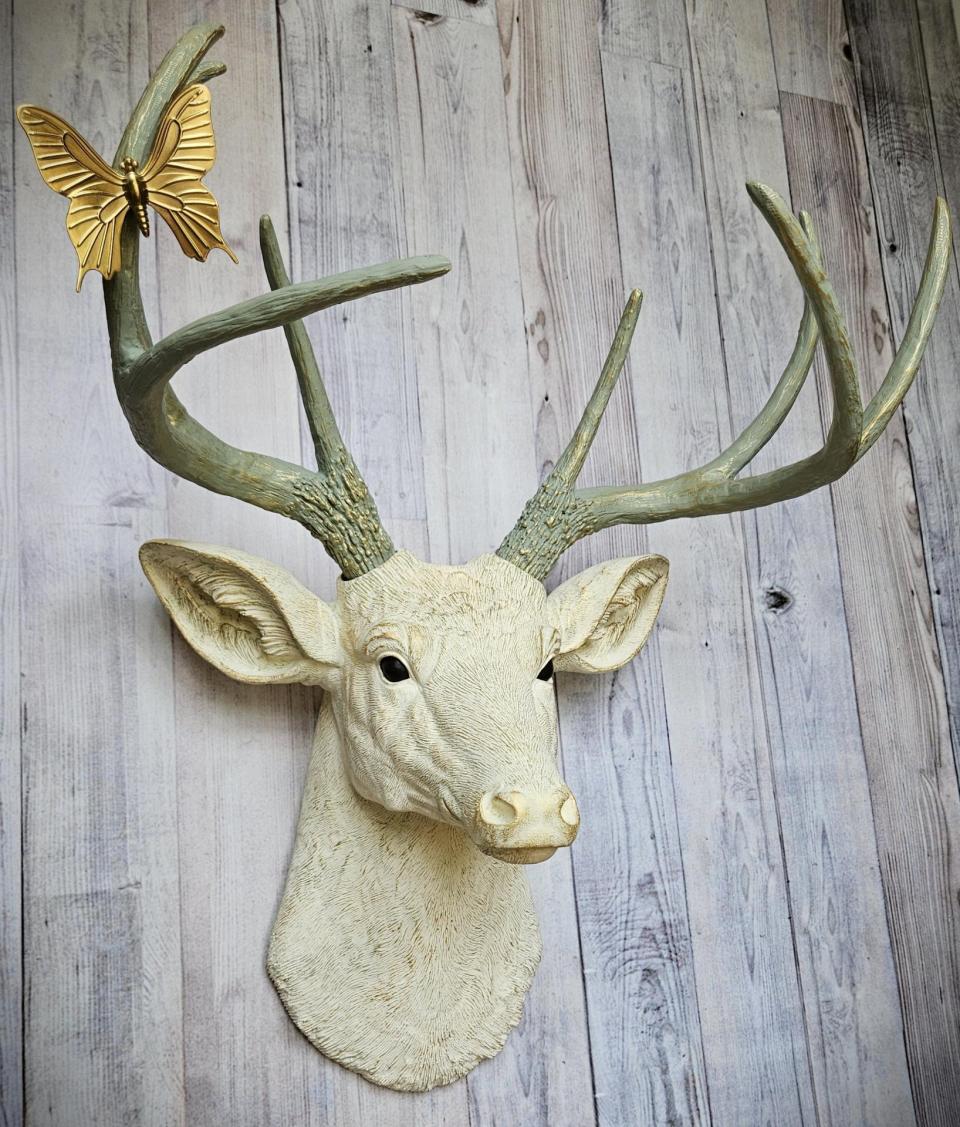 faux taxidermy deer head wall mount, painted antique white with gold and italian sage accents, the antlers are italian sage with gold accents