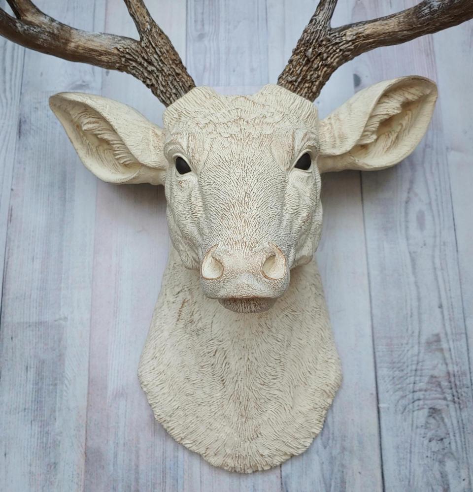 Faux taxidermy deer head wall mount. Head is painted antique white with antique gold accents, antlers are antique gold with antique white accents.
