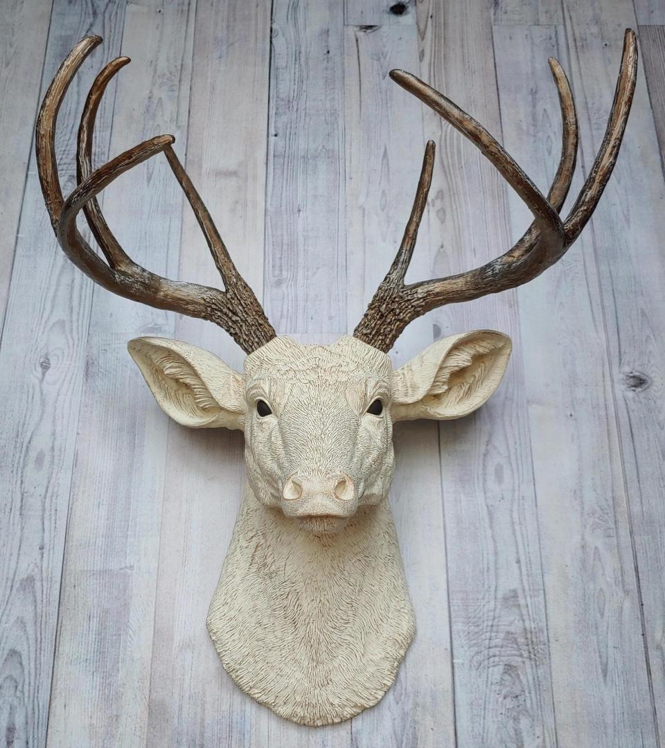 Faux taxidermy deer head wall mount. Head is painted antique white with antique gold accents, antlers are antique gold with antique white accents.