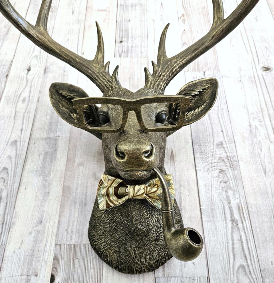 faux taxidermy deer head with glassses, bow tie and pipe, frankie stag