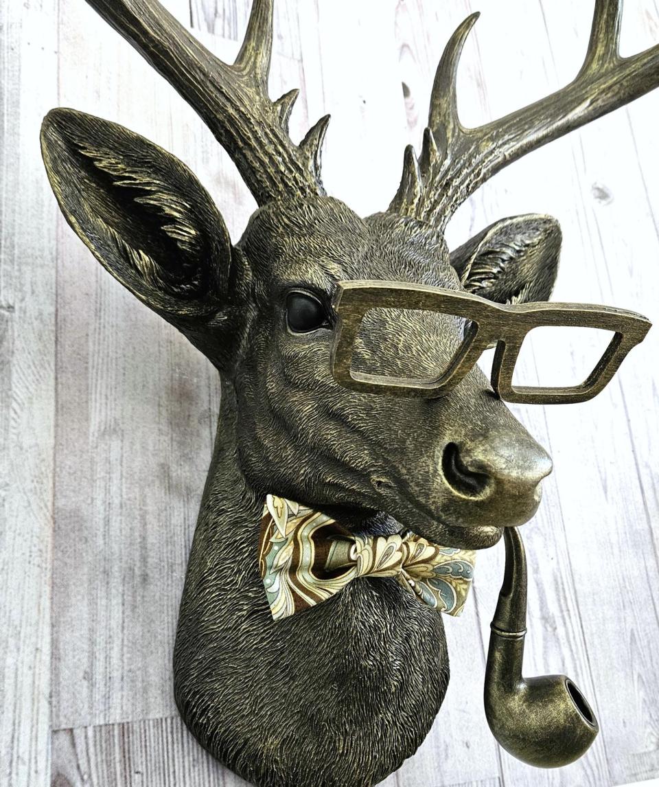 faux taxidermy deer head with glassses, bow tie and pipe, frankie stag