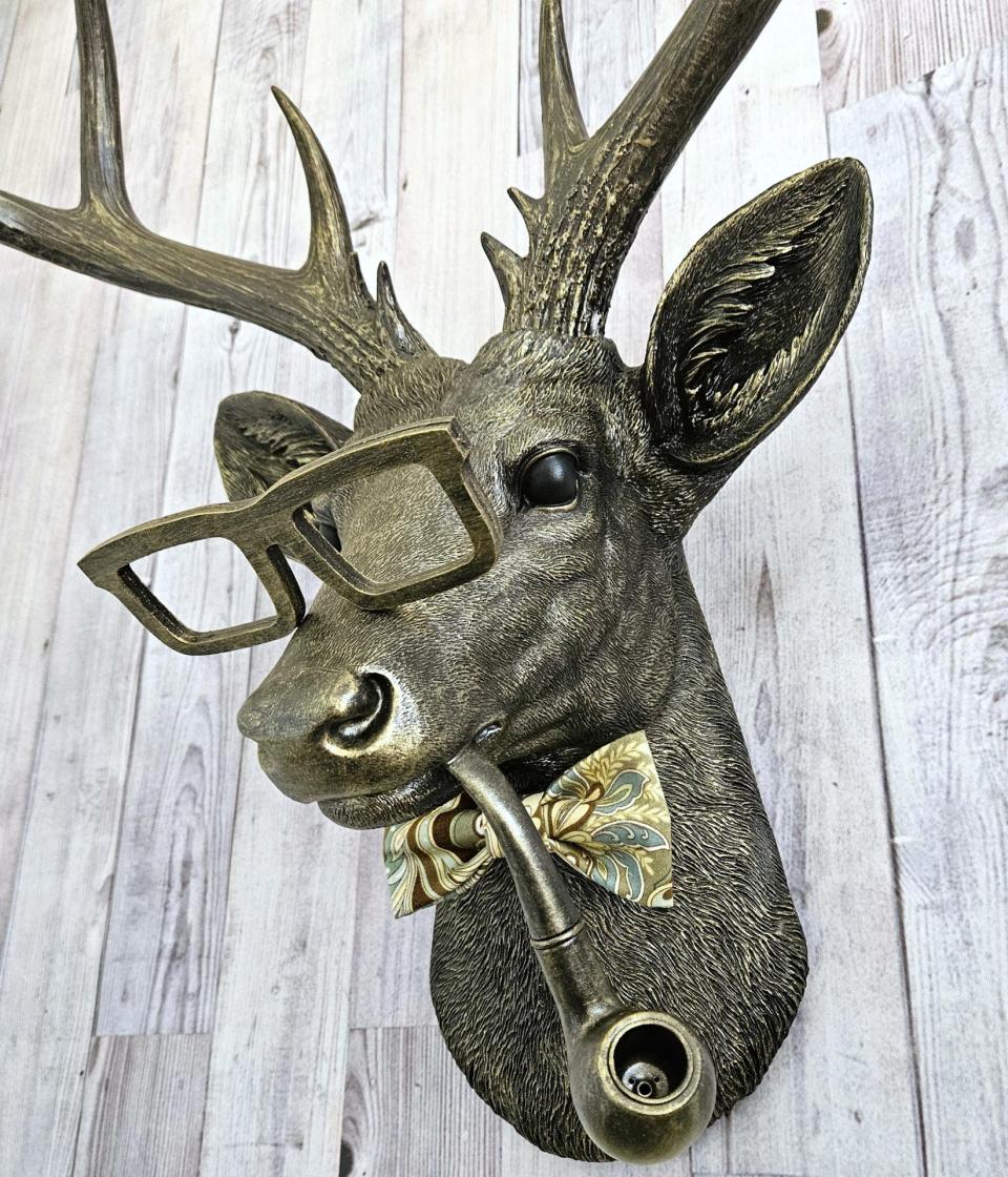 faux taxidermy deer head with glassses, bow tie and pipe, frankie stag