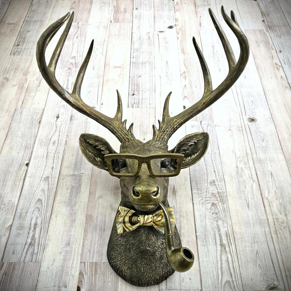 faux taxidermy deer head with glassses, bow tie and pipe, frankie stag