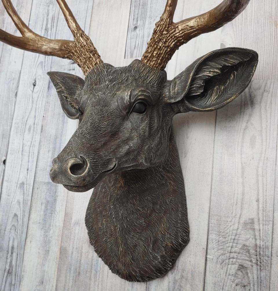 Faux taxidermy deer head painted chestnut brown and accented with antique white and antique gold, in order to bring out the beautiful details in the cast. The antlers have been painted antique gold and the eyes have been painted black.