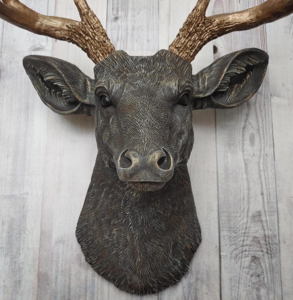 Faux taxidermy deer head painted chestnut brown and accented with antique white and antique gold, in order to bring out the beautiful details in the cast. The antlers have been painted antique gold and the eyes have been painted black.