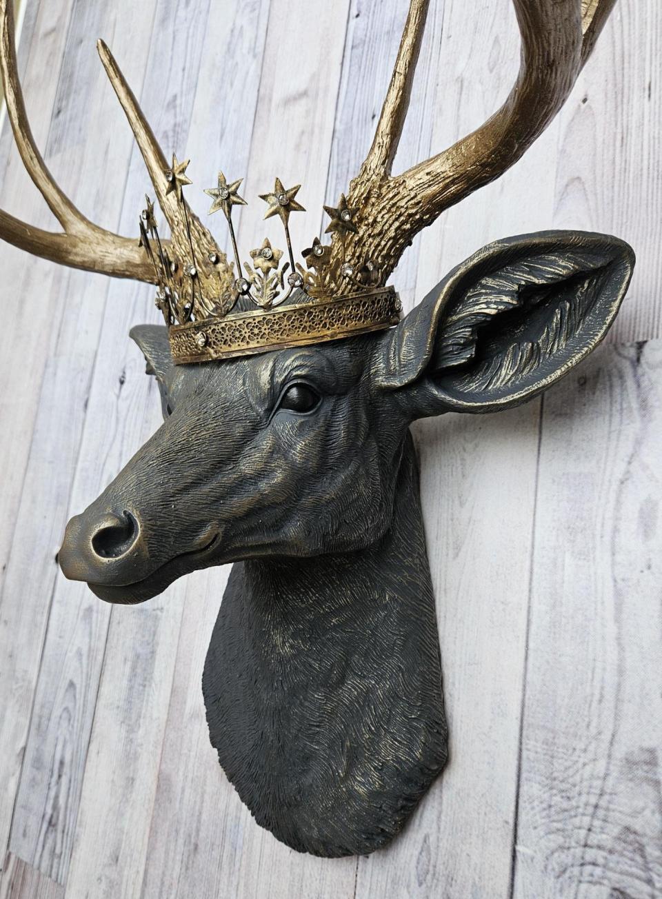 Faux taxidermy deer head, painted slate grey with antique gold accents. The antlers are antique gold and a vintage inspired Santos star crown rests atop the deers head