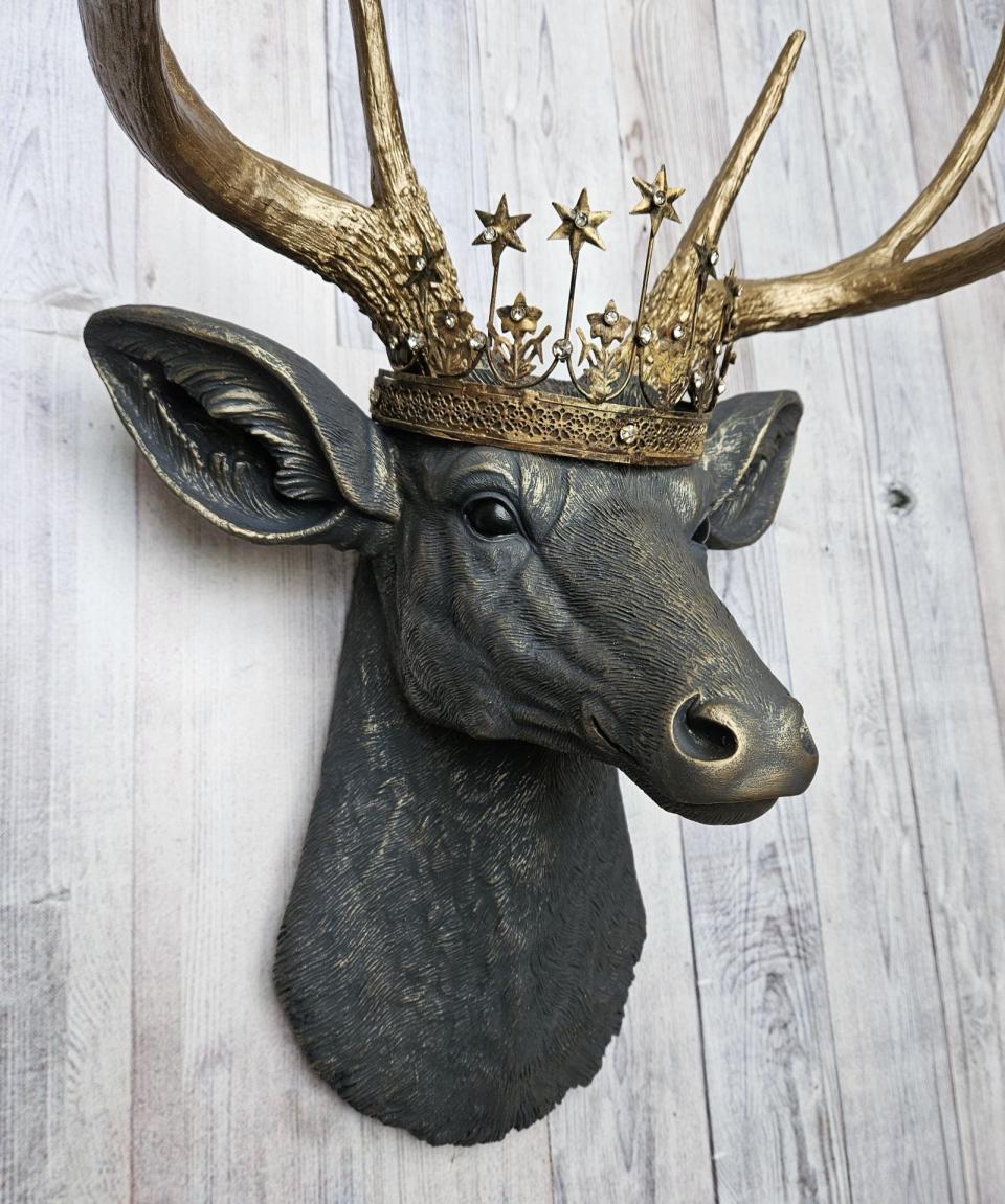 Faux taxidermy deer head, painted slate grey with antique gold accents. The antlers are antique gold and a vintage inspired Santos star crown rests atop the deers head