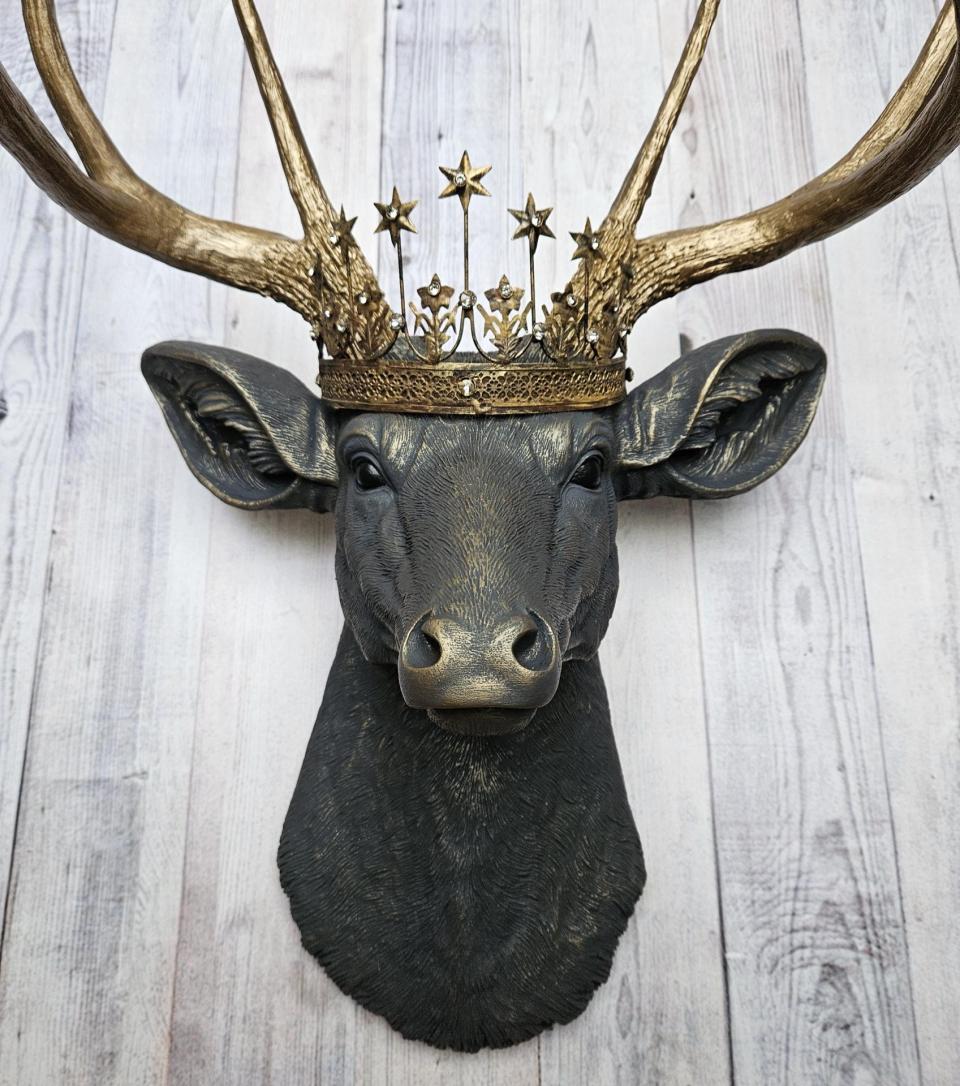 Faux taxidermy deer head, painted slate grey with antique gold accents. The antlers are antique gold and a vintage inspired Santos star crown rests atop the deers head