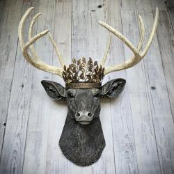 faux taxidermy deer head wall mount. Painted in a chestnut brown, antique white and gold finish with a antiqued gold metal leaf crown on the top of its head.