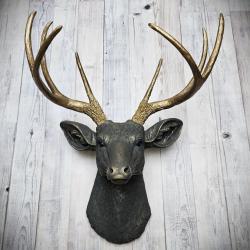 Faux taxidermy deer head, painted slate grey with antique gold accents. 