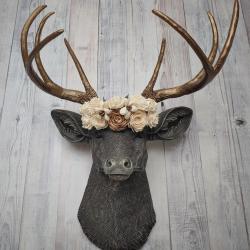 Faux taxidermy deer head, painted chestnut brown with antique white and gold accenting. The antlers are antique gold and a cream floral crown sits atop the deer head.