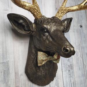 Faux taxidermy deer head painted rubbed bronze with gold antlers and a removable brown multi colored bow tie