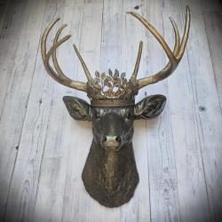 Faux taxidermy deer head wall mount. Painted rubbed bronze with antique gold accents. The antlers are antique gold and an antique gold metal leaf crown rests atop the deer head.