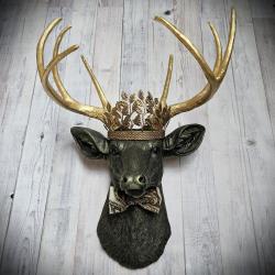 Faux taxidermy deer head with gold metal leaf crown and bow tie.